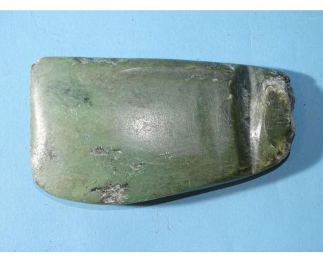 A carved green hardstone axe head, 12.5 x 7 x 1.5cm. 