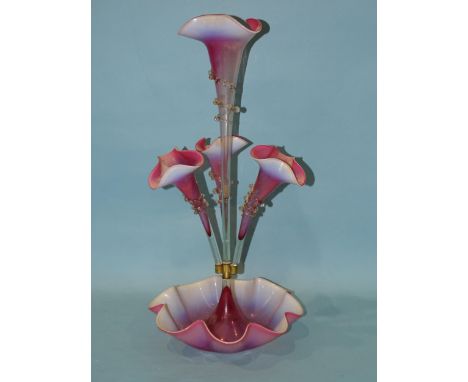 A late-19th century pink and opaline glass epergne, the central trumpet vase flanked by three further vases with applied clea