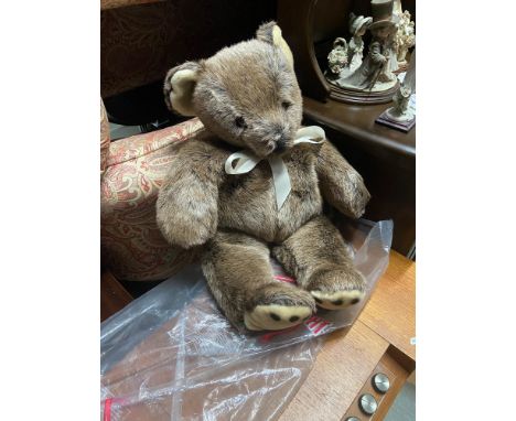 A Large vintage Merrythought teddy bear with original Polly bag and tags. Never played with. 