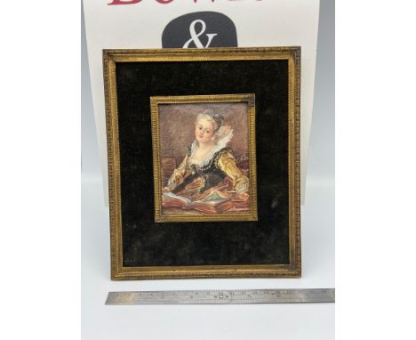 A Regency miniature portrait painting of a young woman reading. Signed D' Fragonard. Fitted with a concave glass, gilt trim a