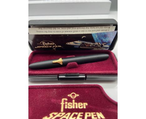 A Vintage Fisher Space Pen, Matt black bullet design  and fitted with a gilt metal space shuttle, Comes with pamphlet and box
