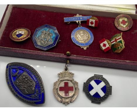 A Lot of vintage nursing badges and various pin badges. Includes three Birmingham silver and enamel nursing badges and fob. 
