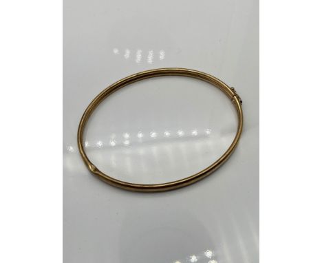 A 9ct gold bangle. [7x6cm][5 grams] 