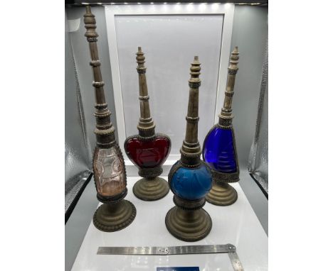 A Lot of four vintage perfume bottles all designed with plated panels, stands and funnels 