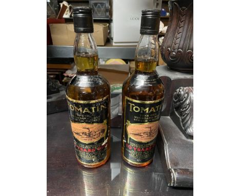 Two Bottlings of Tomatin fine old Highland Malt Scotch Whisky. Both 10 Years old. 