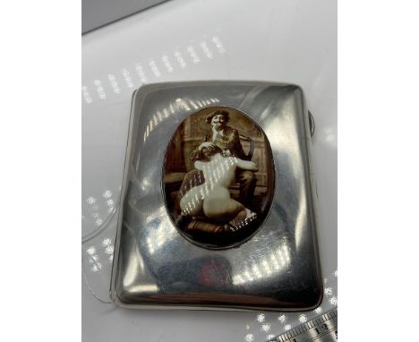 A Birmingham silver cigarette case designed with an enamel image of a semi nude female. [6.8x8.4cm] 