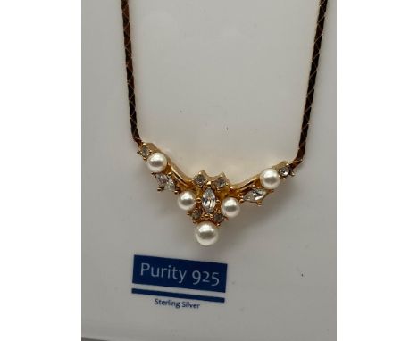 Christian Dior gold plated ladies necklace and ornate pendant designed with pearls and clear stones. 