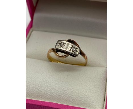 A ladies 18ct gold and Platinum Diamond ring. Designed with two diamonds. [Ring size K] [2 Grams] 