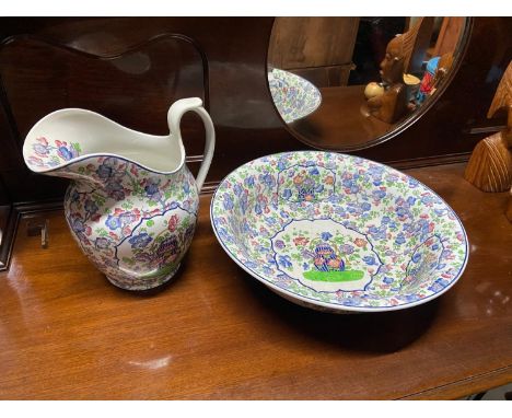 A Large wash hand basin with matching jug produced by Copeland Spode Late English. 