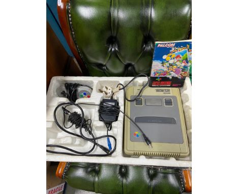 A Vintage Super Nintendo console with original box 