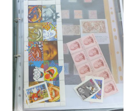 An album of British stamps and two first day covers 