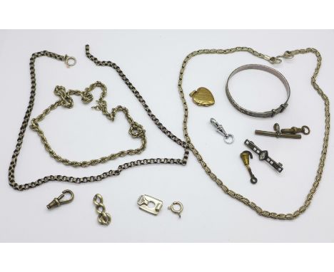 Two silver necklaces, a silver bangle and a silver brooch, one other necklace, a 9ct gold back and front locket, etc. 