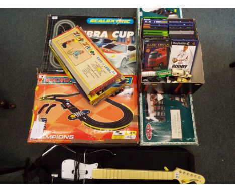 A good lot to include two Scalextric sets both boxed, a telescope and tripod, a Santa's steam engine Christmas decoration, si