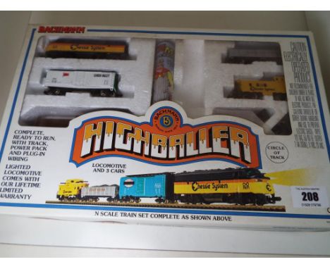 Model Railways N Guage - a Bachmann Highballer boxed set, locomotive with illumination, three cars with power pack, (no track