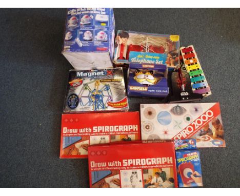 A Tomy Omni Jr. remote controlled robot in original box, a Magnetix extreme combo Ferris wheel building set, 4 Spirograph set