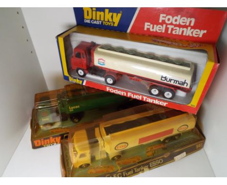 Dinky Toys - three diecast model fuel tankers comprising # 950 Burmah, # 945 Esso and Lucas Oil, all models appear mint, Esso