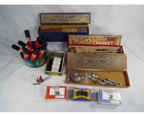 A good lot to include a Joy-O-Scope kaleidoscope in original box, a vintage table croquet game, 5 Johillco Series Metal Toys 