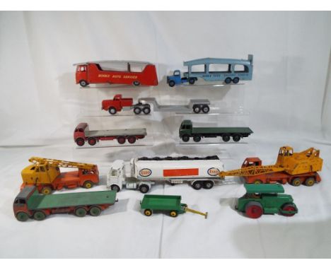 Dinky Toys - A quantity of 11 Dinky models to include a Foden 4 axle flatbed rigid lorry with orange cab and chassis with gre