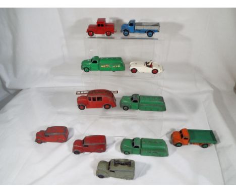 Dinky Toys - A quantity of 11 unboxed, play worn Dinky model motor vehicles to include, a Fire engine, a red van with black w