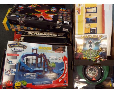 A good mixed lot to include a Fastline car racing game, fairground collection shooting gallery, a laser pegs light and constr