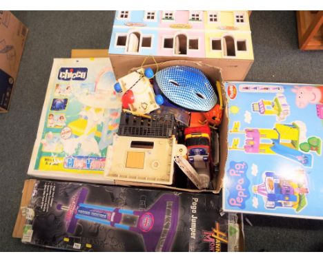 A good mixed lot to include a Chicco Miss Vanity playset, a wooden row of shops playset, a Hanna Montana pogo stick, a Peppa 