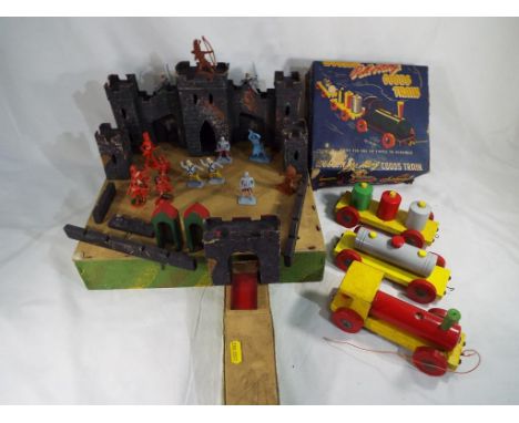 An early wooden toy fortress with model soldiers and a wooden Pull-Along goods train, boxed [2]