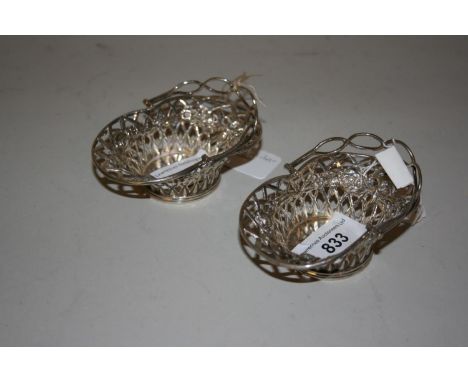 Pair of Chester silver basket shaped trinket dishes with swing handles 