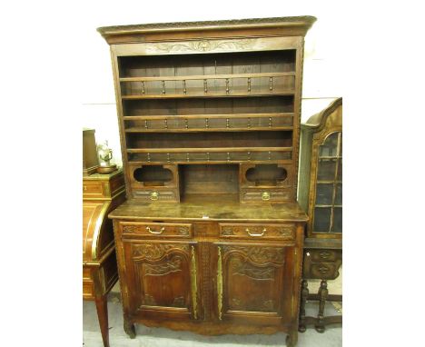 18th Century French fruitwood dresser, the boarded shelf back with two drawers and spindle galleries, the base with two small