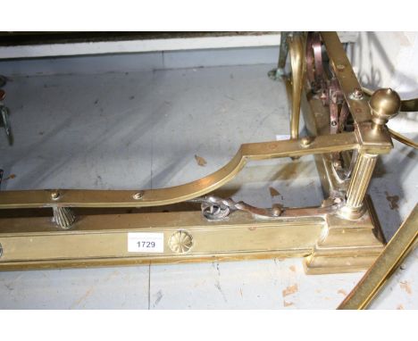 Edwardian brass fireplace fender, an Edwardian brass coal purdonium and a quantity of fire tools 