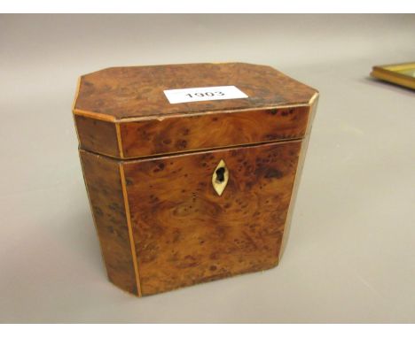 Small George III burr, yew and boxwood strung tea caddy of irregular octagonal design 