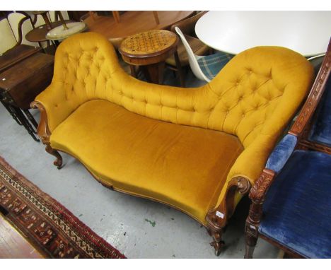 Victorian walnut and button upholstered double chair back sofa on scroll carved and cabriole front supports 