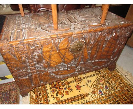 Early to mid 20th Century oriental carved camphor wood trunk with all-over decoration (by repute once the property of Captain