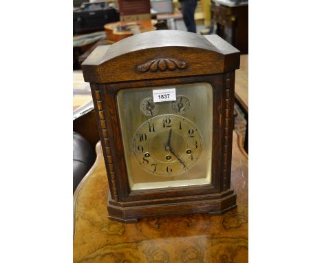 Early 20th Century oak mantel clock, the silvered dial with Arabic numerals, chime / silent selector and advance / retard sel