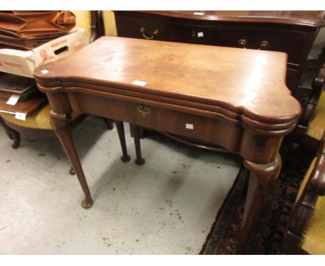 George II mahogany games table, the triple fold-over top enclosing inlays for chess and backgammon and a baize lined cards pl