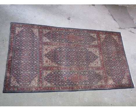 Large Tabriz carpet of unusual five panel Herati and medallion design on a midnight blue ground with ivory corner designs and