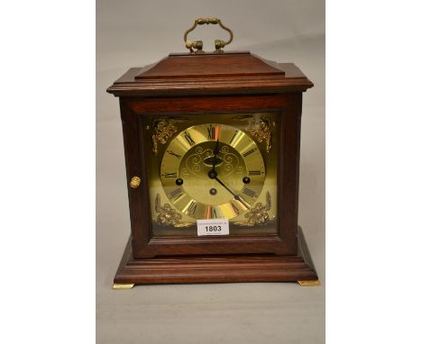 Reproduction mahogany bracket clock with a gilded dial and a three train German movement striking on a gong 