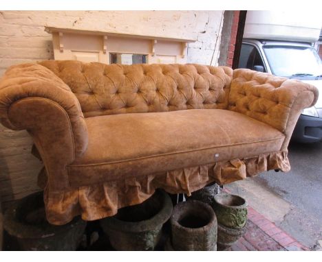 Victorian button upholstered Chesterfield type sofa on low supports 