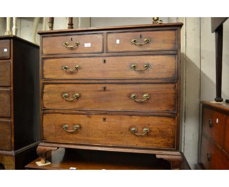 Early 19th Century mahogany chest of two short over three long graduated drawers with later brass handles and ogee bracket fe