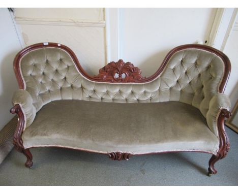 Victorian carved mahogany and button upholstered double chair back sofa on cabriole supports 