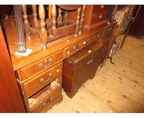 Reproduction mahogany twin pedestal desk, the brown leather inset top above nine drawers with cast handles and bracket feet, 