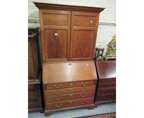 George III satinwood bureau bookcase, the moulded cornice above a pair of panelled doors, the fall front enclosing a fitted i