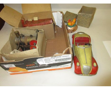 20th Century tin plate clockwork model of a vintage car, boxed clockwork easter egg mounted with a chicken, Mamod stationary 