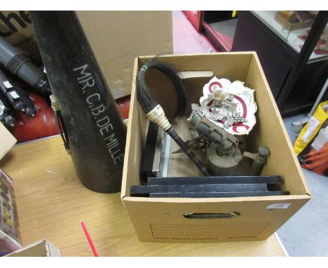 Box containing a quantity of miscellaneous items including a loud hailer inscribed Mr C.B. DeMille, plated candelsticks, alar