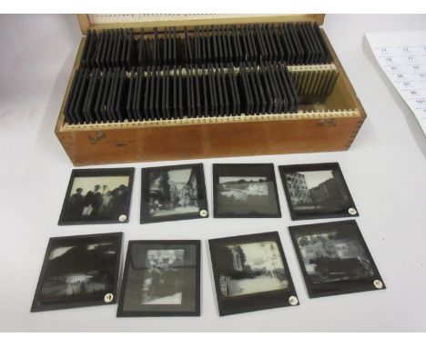 Wooden cased part set of black and white magic lantern slides, various scenes 