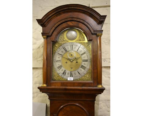 Figured walnut longcase clock, the broken arch hood with flanking pilasters above a moulded panel door and conforming plinth 