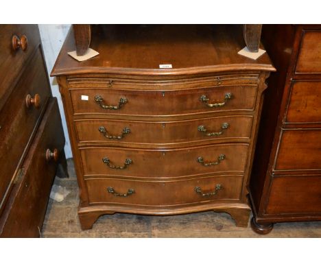 Reproduction mahogany serpentine shaped four drawer chest with pull-out slide and bracket feet 