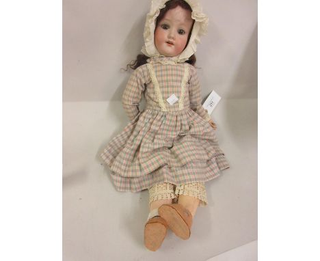 Armand Marseille A5M bisque headed doll with sleeping eyes and open mouth with four teeth on a jointed composition body with 