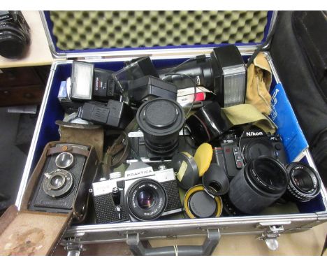 Nikon F-501 camera , Voigtlander camera, Minolta camera, Praktica camera together with various accessories 