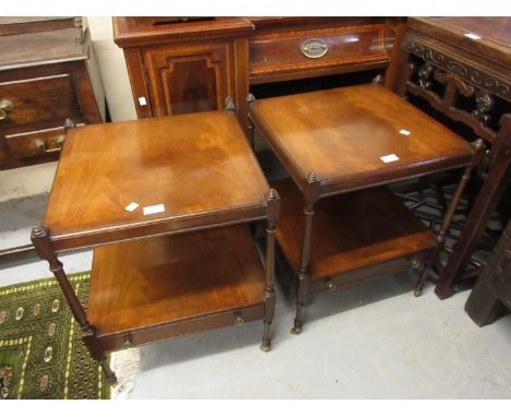 Pair of reproduction mahogany two tier lamp tables on slender baluster turned supports with single drawer having brass knob h