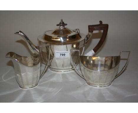 Mappin and Webb Sheffield silver three piece tea service of oval faceted design 